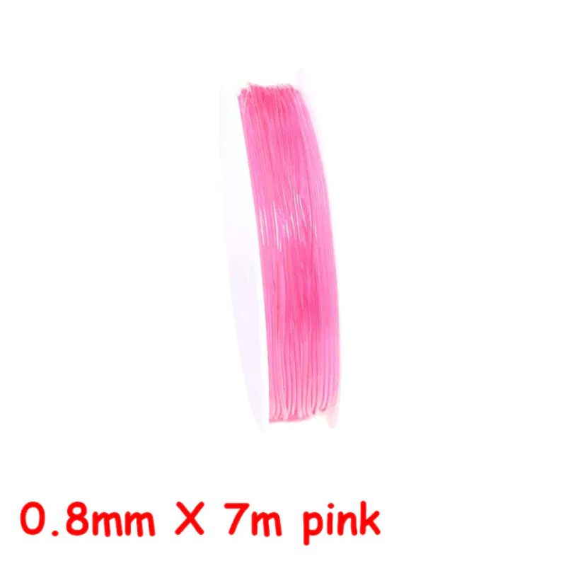 a pink and pink pink surfboard is sitting on a table 