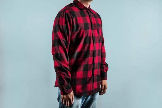 a man is standing on a bench with his skateboard 